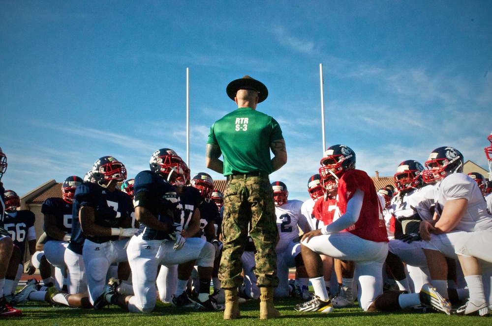 A Marine drill instructor gives a pep talk to the football players of the Semper Fidelis All-American bowl East Coast team