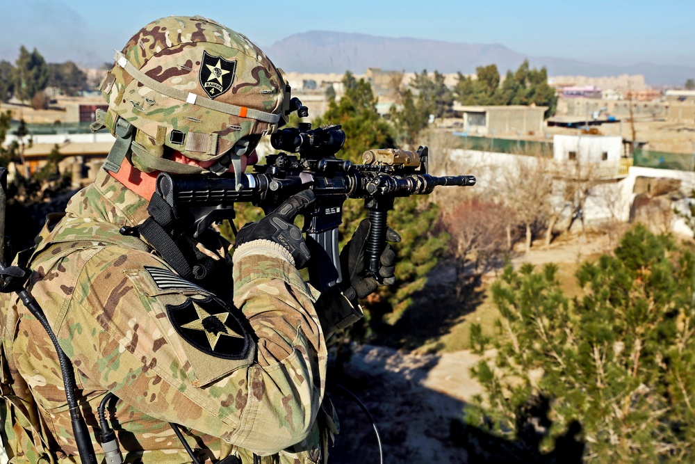 1st Lt. Ryan Schulte uses his advanced combat optical gunsight to scan for security threats