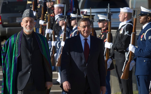 Secretary Panetta escorts Afghanistan's President Hamid Karzai to a full honors arrival ceremony