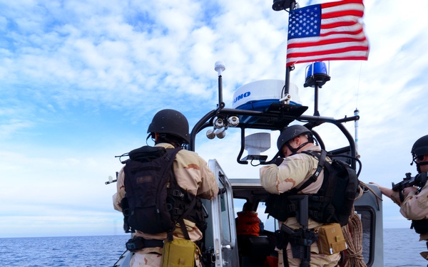 Sailors on a visit, board, search and seizure team race across the Atlantic Ocean