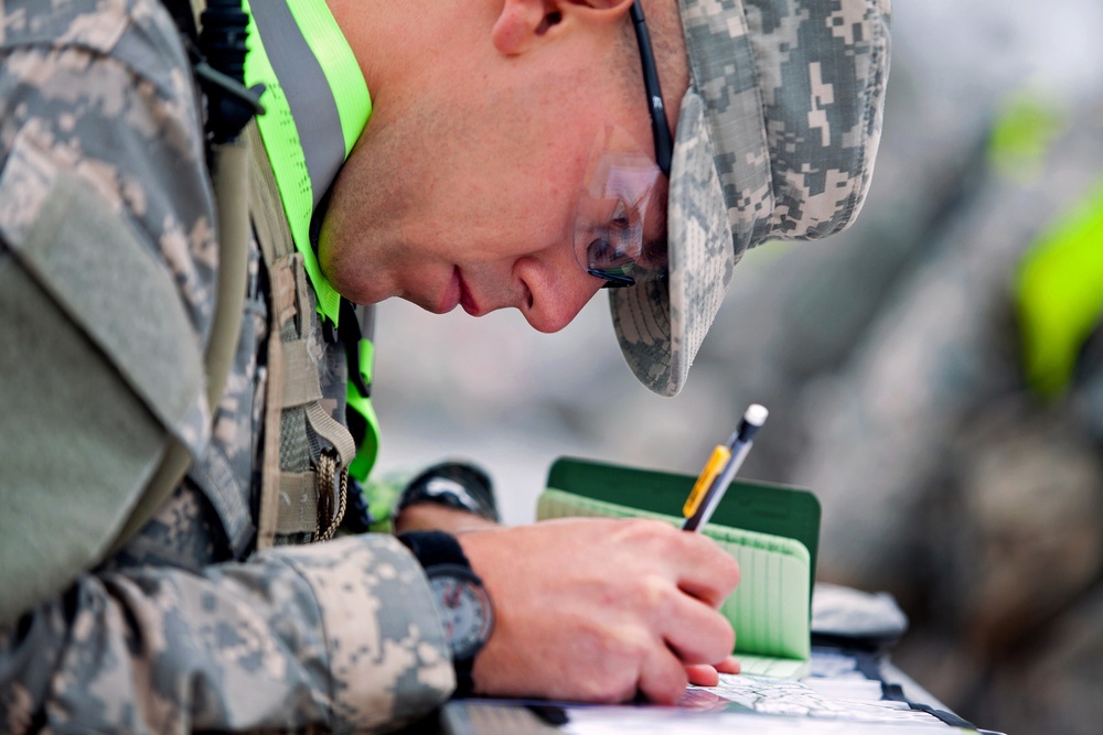 Army 2nd Lt. Jordan Marks plots his points on a map