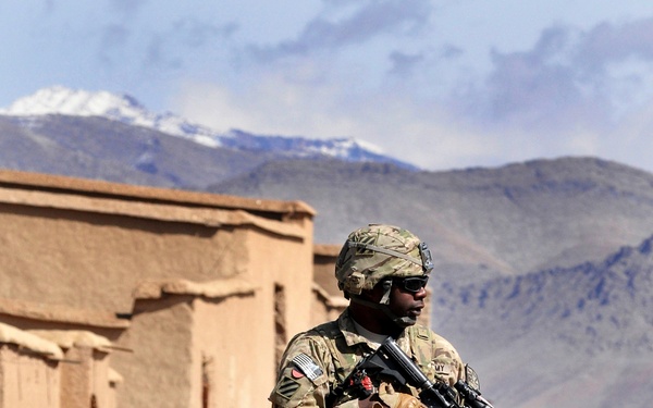 Army Sgt. Tyger Benoit and members of Charlie Company patrol through the Uruzgan province