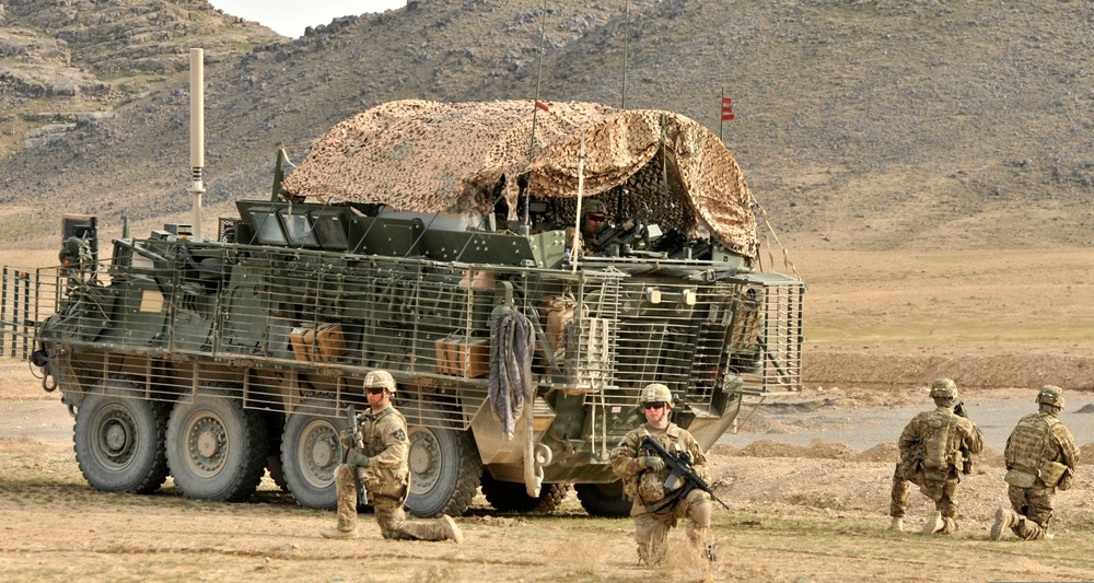 Soldiers secure the area outside an Afghan Uniformed Police checkpoint