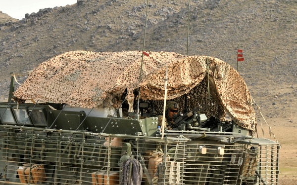 Soldiers secure the area outside an Afghan Uniformed Police checkpoint