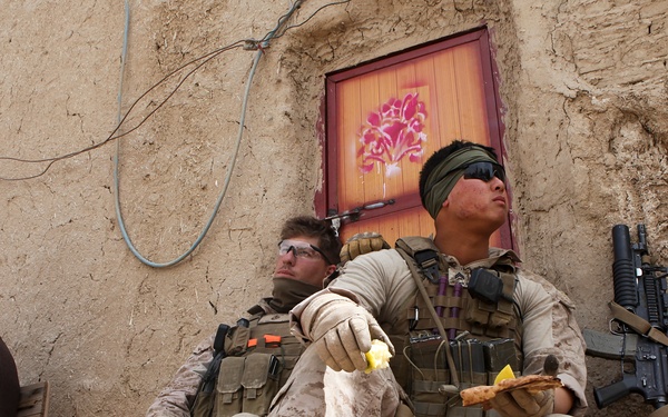 Cpl. Kim and Lance Cpl. Brockwell take a break at the Afghan Uniform Police Outpost Mamuriyet