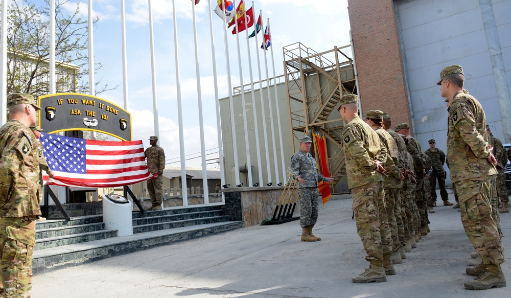Gen. Dempsey talks with service members before a re-enlistment ceremony in Bagram