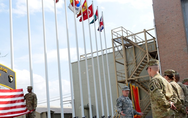 Gen. Dempsey talks with service members before a re-enlistment ceremony in Bagram