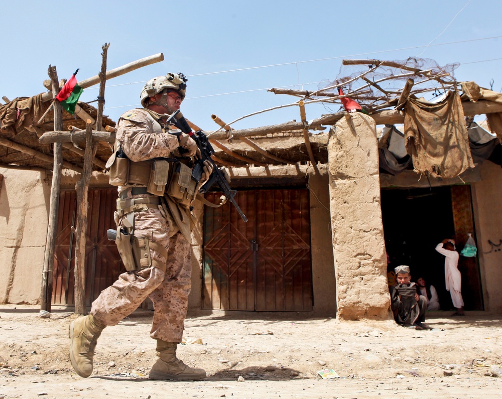 Sgt. Benito Serrano patrols through the bazaar near Outpost Mamuriyet