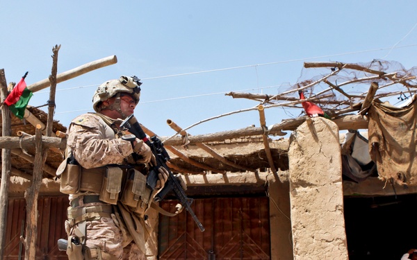 Sgt. Benito Serrano patrols through the bazaar near Outpost Mamuriyet