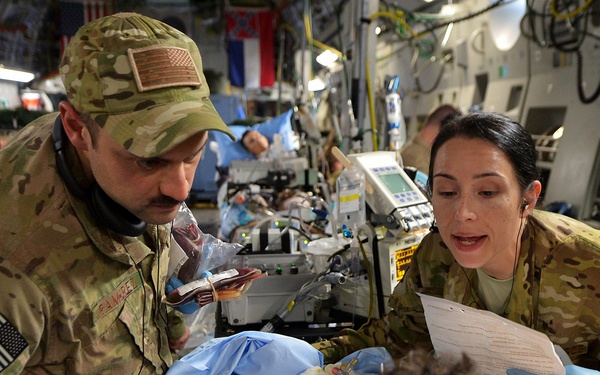 Air Force Capt. Mario Ramirez and Capt. Suzanne Morris confirm a patient's identity