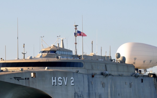 The High-Speed Vessel Swift (HSV-2) gets underway with a tethered Aerostat balloon