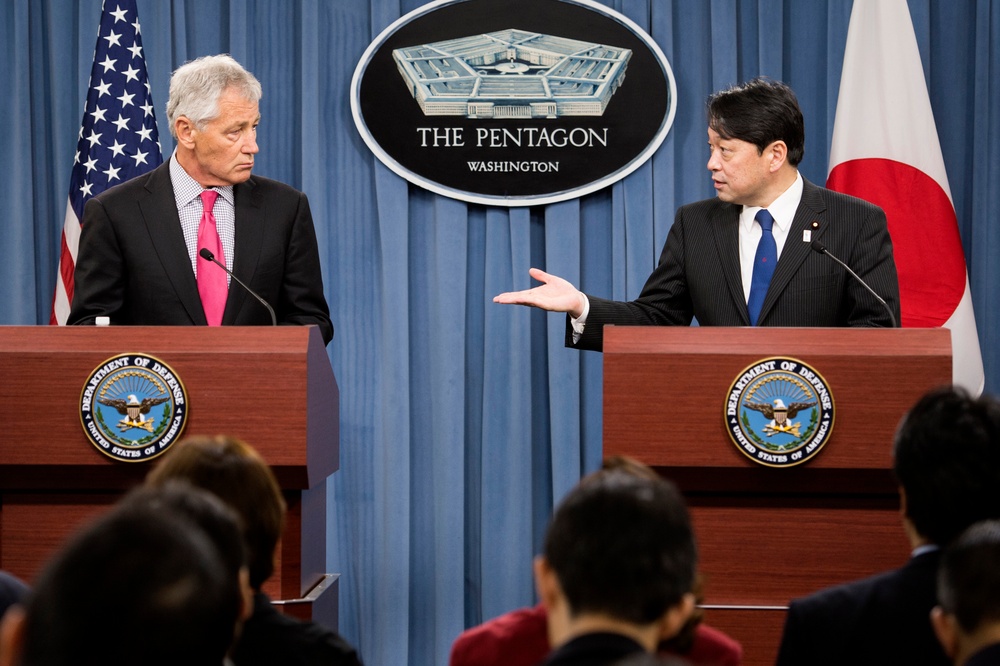 Secretary Hagel listens to Japan's Minister of Defense Itsunori Onodera answer a reporter’s question