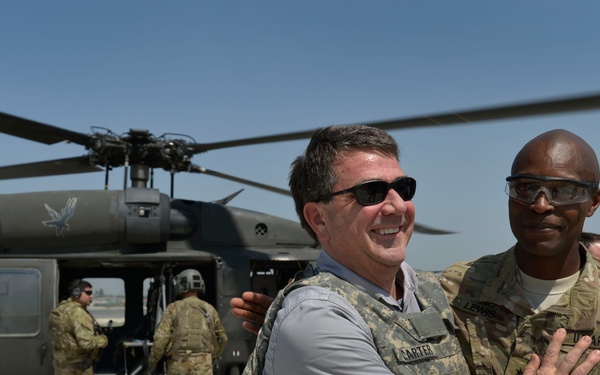 Deputy Secretary Carter receives a warm welcome from Brig. Gen. Lewis as he arrives at Jalalabad