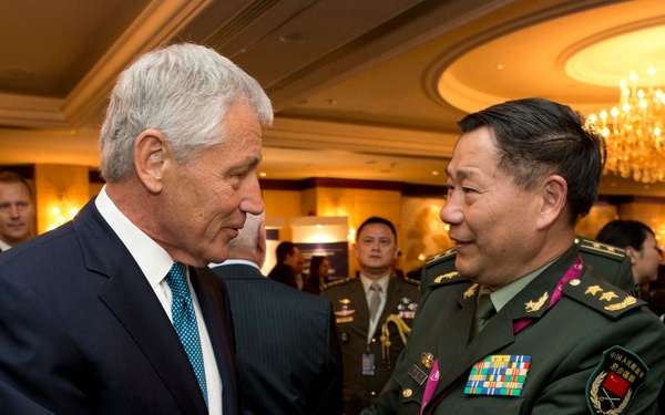 Secretary Hagel greets Deputy Chief of General Staff for the People's Liberation Army Gen. Qi Jianguo at the start of the Shangri-La Dialogue