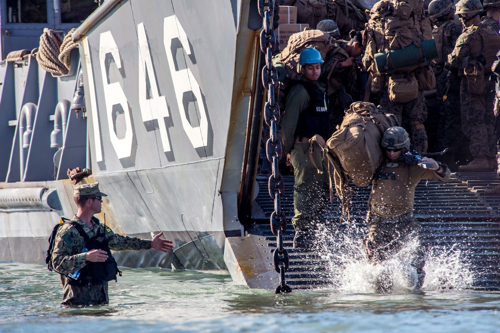 U.S. Marines from the 31st Marine Expeditionary Unit wade ashore
