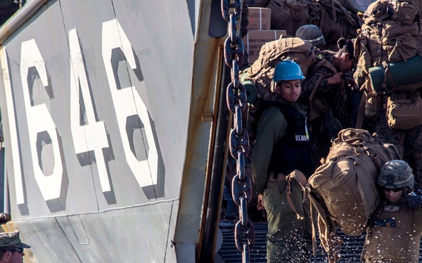 U.S. Marines from the 31st Marine Expeditionary Unit wade ashore