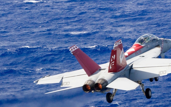 A Navy F/A-18F Super Hornet launches from the aircraft carrier USS George Washington