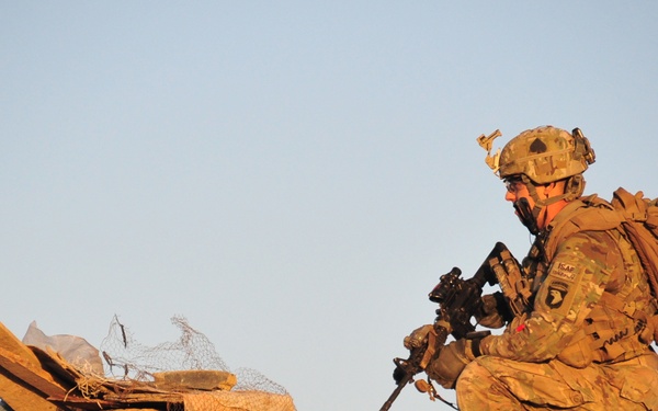 U.S. Army Sgt. Damon Miers scans his surrounding area during a partnered patrol