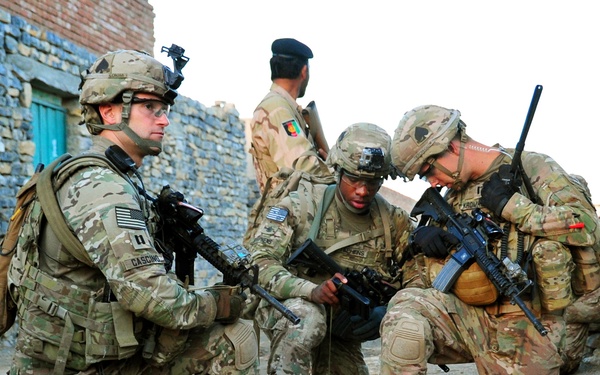 Staff Sgt. Stephens and 1st Lt. Kromhout verify their position during a partnered patrol