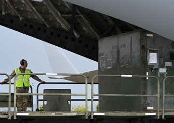 Training in Motion: 734th AMS conducts C-17 engine running offload
