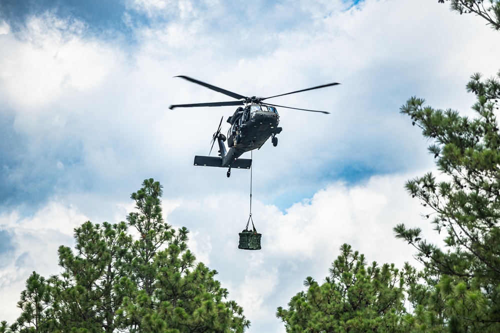 Devil Avalanche Sling load, Above the trees