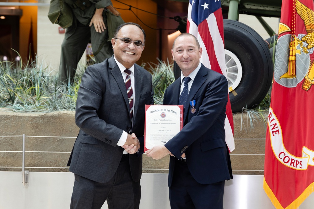 Keegan Mills receives Meritorious Civilian Service Award