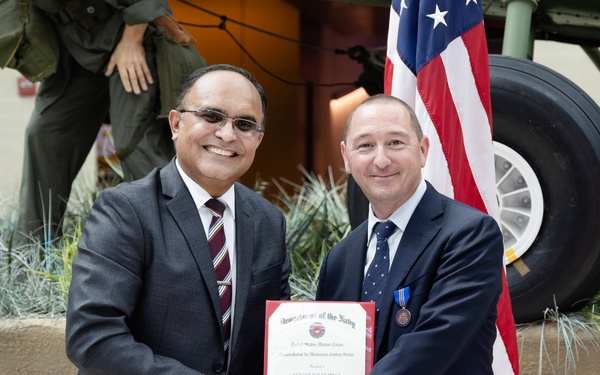 Keegan Mills receives Meritorious Civilian Service Award