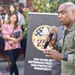 Rear Adm. Stephen Barnett, commander, Navy Region Hawaii (CNRH), speaks with community members as they wait at the Commander, U.S. Pacific Fleet (COMPACFLT) boathouse to board a boat for a guided tour.
