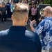 Commander, Navy Region Hawaii (CNRH) historian, James Newman, speaks with community members as they wait at the Commander, U.S. Pacific Fleet (COMPACFLT) boathouse to board a boat for a guided tour.