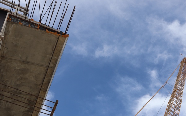 A Crane Towers Overhead During Construction on Camp Blaz