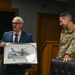RAF Mildenhall commander Col. Garlow is presented with an award by the British Ministry of Defense