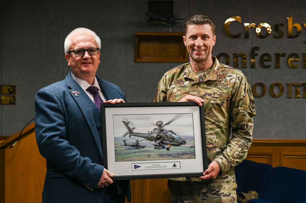 RAF Mildenhall commander Col. Garlow is presented with an award by the British Ministry of Defense