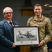 RAF Mildenhall commander Col. Garlow is presented with an award by the British Ministry of Defense