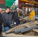 USS Frank Cable (AS 40) Sailors participate in a COMREL at Queensland Maritime Museum