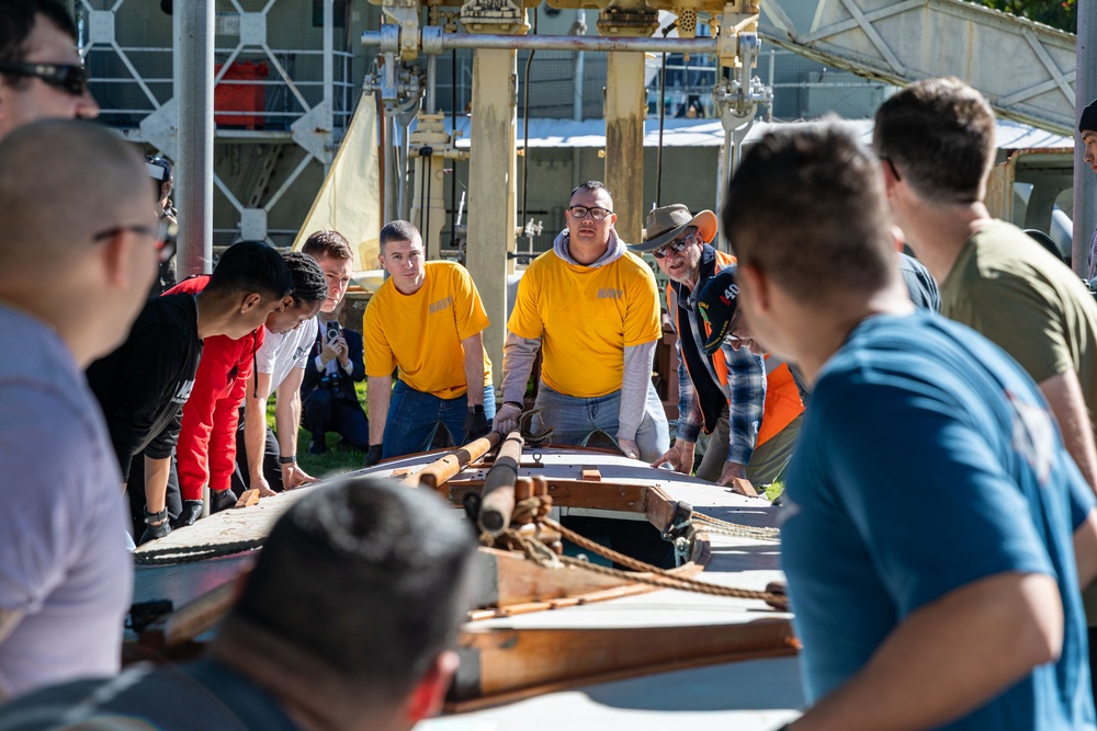 USS Frank Cable (AS 40) Sailors participate in a COMREL at Queensland Maritime Museum
