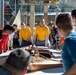USS Frank Cable (AS 40) Sailors participate in a COMREL at Queensland Maritime Museum