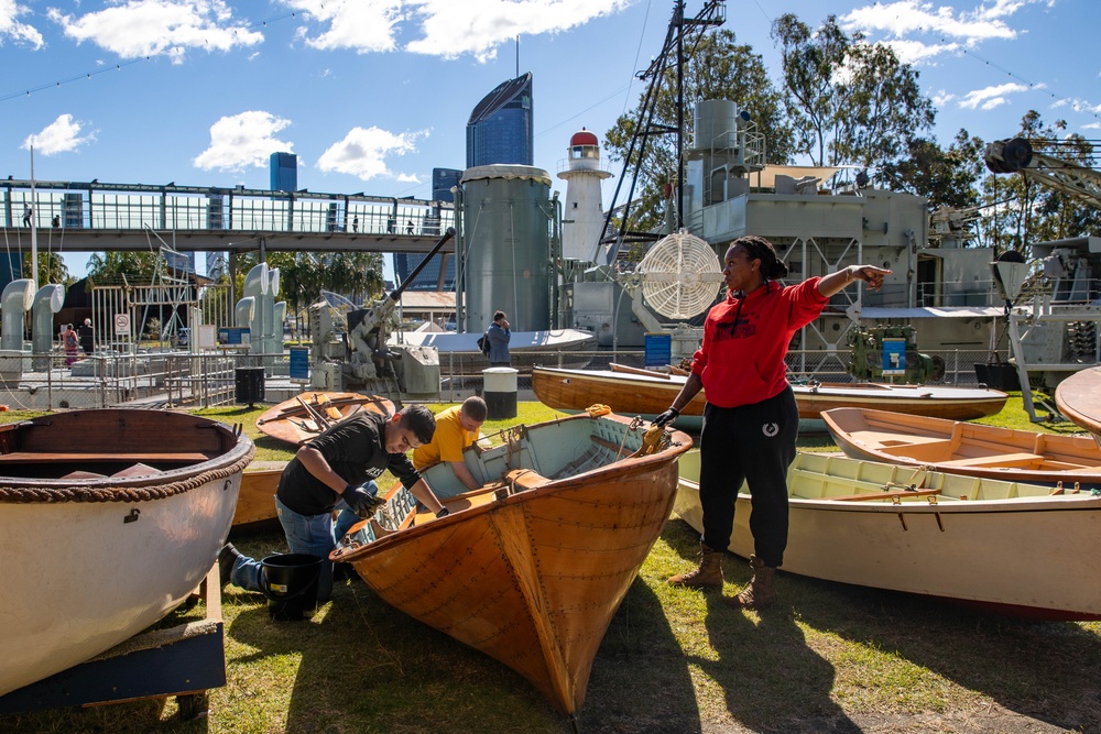 USS Frank Cable (AS 40) Sailors participate in a COMREL at Queensland Maritime Museum