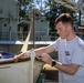 USS Frank Cable (AS 40) Sailors participate in a COMREL at Queensland Maritime Museum