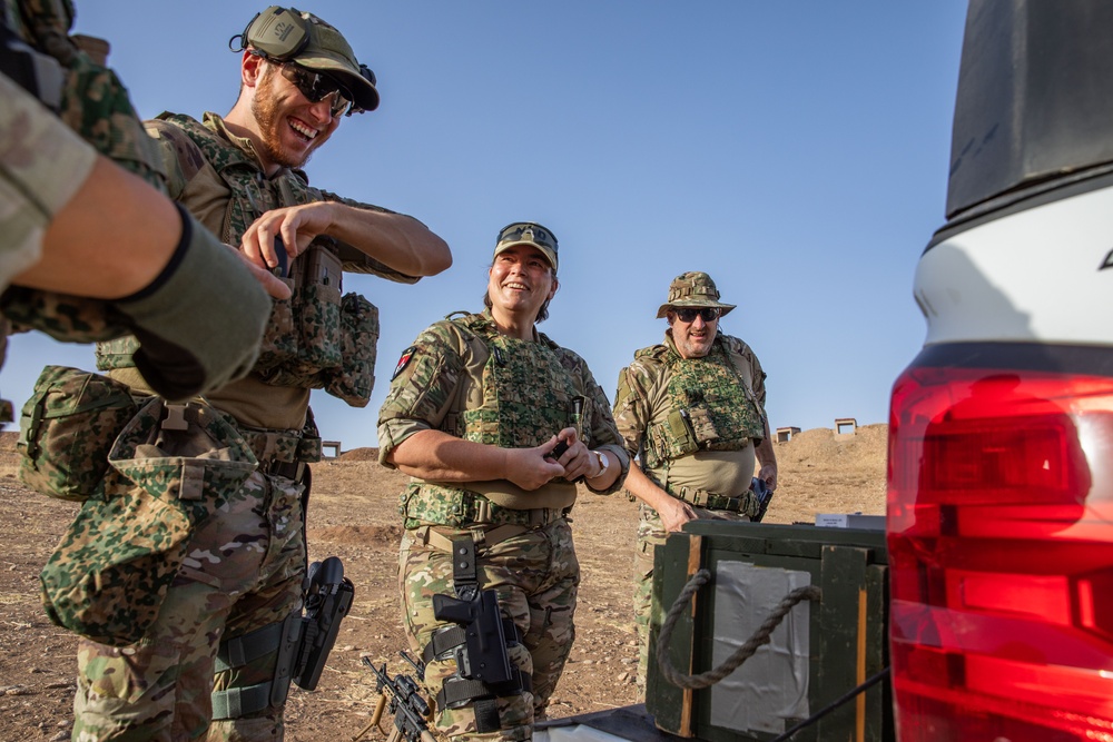 Coalition Members Conduct Weapons Training at Beneslawa Range