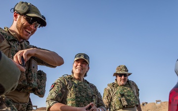 Coalition Members Conduct Weapons Training at Beneslawa Range