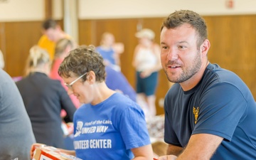 NMCB ONE Seabees Pack Youth Food Bags During Navy Week