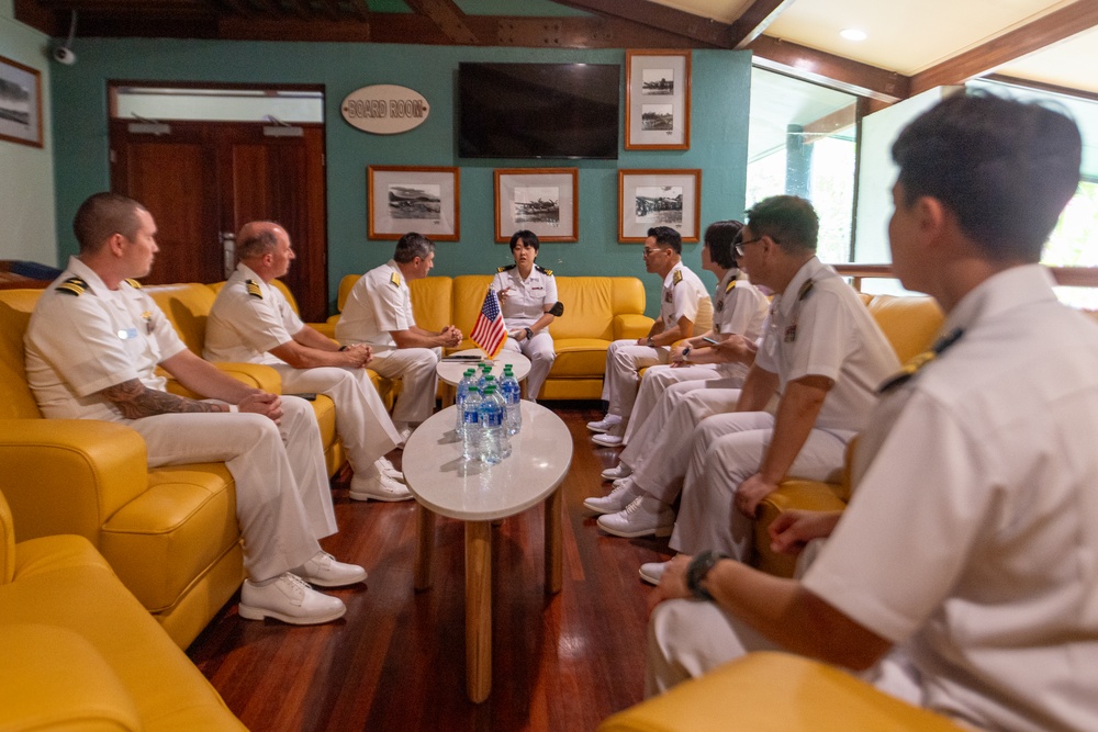 U.S. Navy Sailors and Republic of Korea Sailors conduct a meeting during Pacific Partnership 2025 in Lae, Papua New Guinea, July 2025