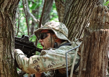 Alpha team leader from Brutal Company fires from a fighting position during a situation training exercise at Camp Casey, South Korea, July 29, 2025