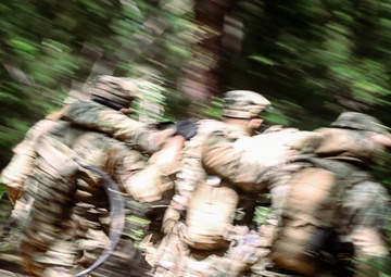 Soldiers from B Co., 4-9IN evacuate a simulated casualty under fire during a situational training exercise at Camp Casey, South Korea, July 29, 2025
