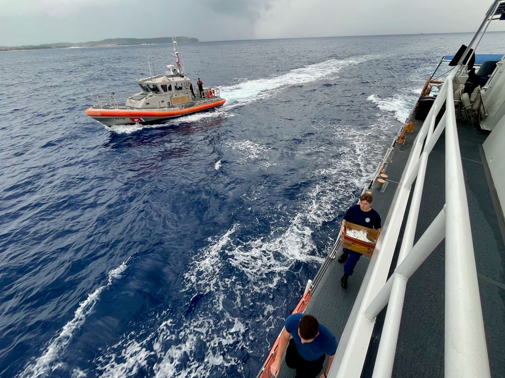  USCGC Myrtle Hazard (WPC 1139) delivers dinner to Station Apra Harbor crews underway