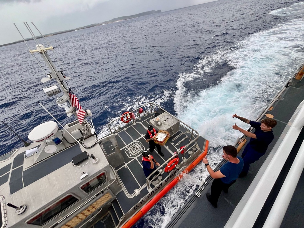  USCGC Myrtle Hazard (WPC 1139) delivers dinner to Station Apra Harbor crews underway