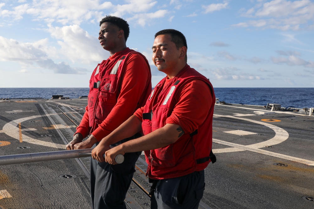 Sailors aboard the USS John Finn conduct flight quarters in the Indian Ocean