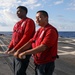 Sailors aboard the USS John Finn conduct flight quarters in the Indian Ocean