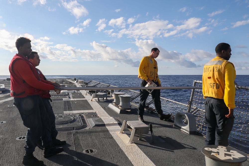 Sailors aboard the USS John Finn conduct flight quarters in the Indian Ocean
