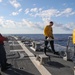 Sailors aboard the USS John Finn conduct flight quarters in the Indian Ocean